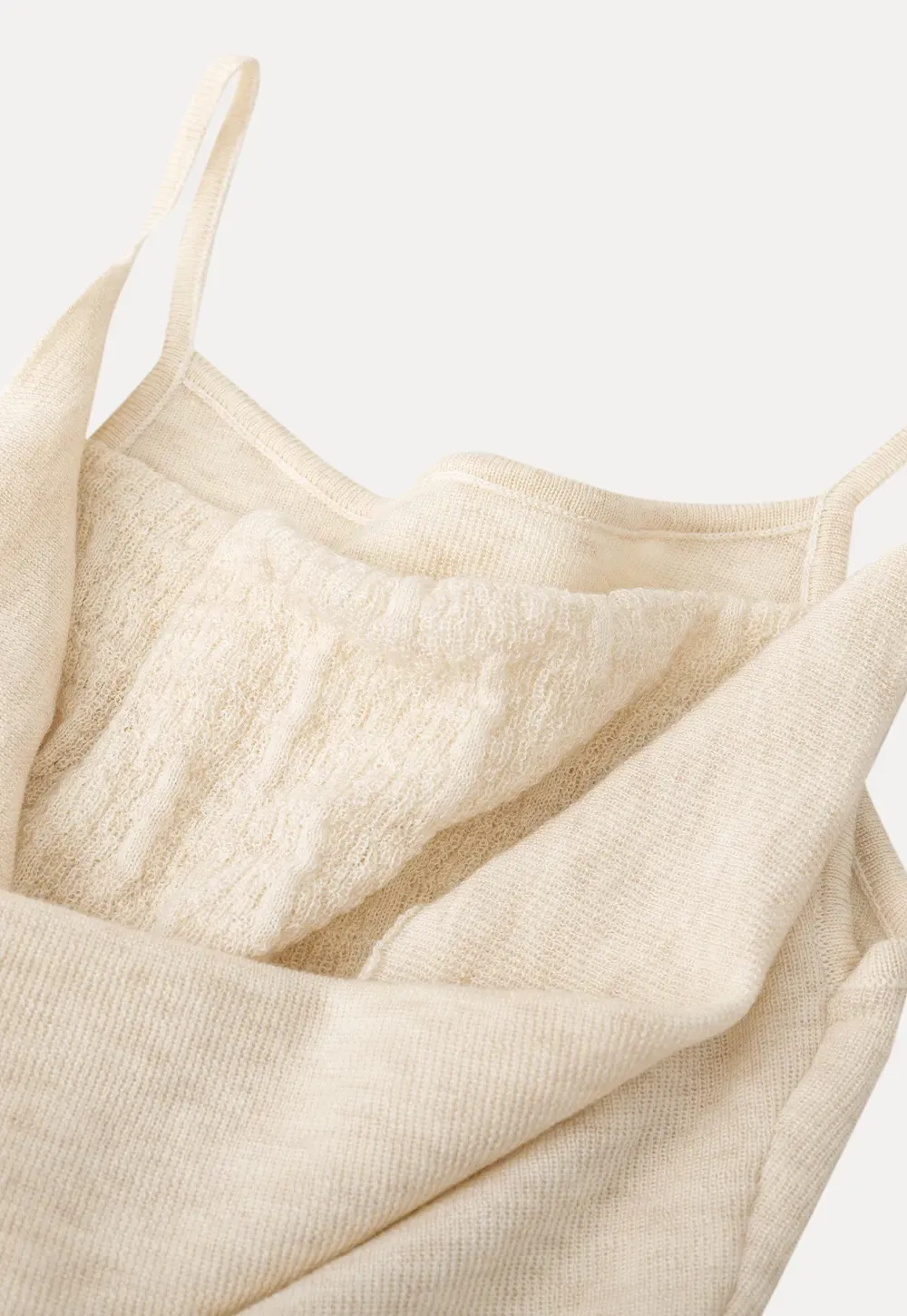 Silk-like tank top with thin straps and draped neckline