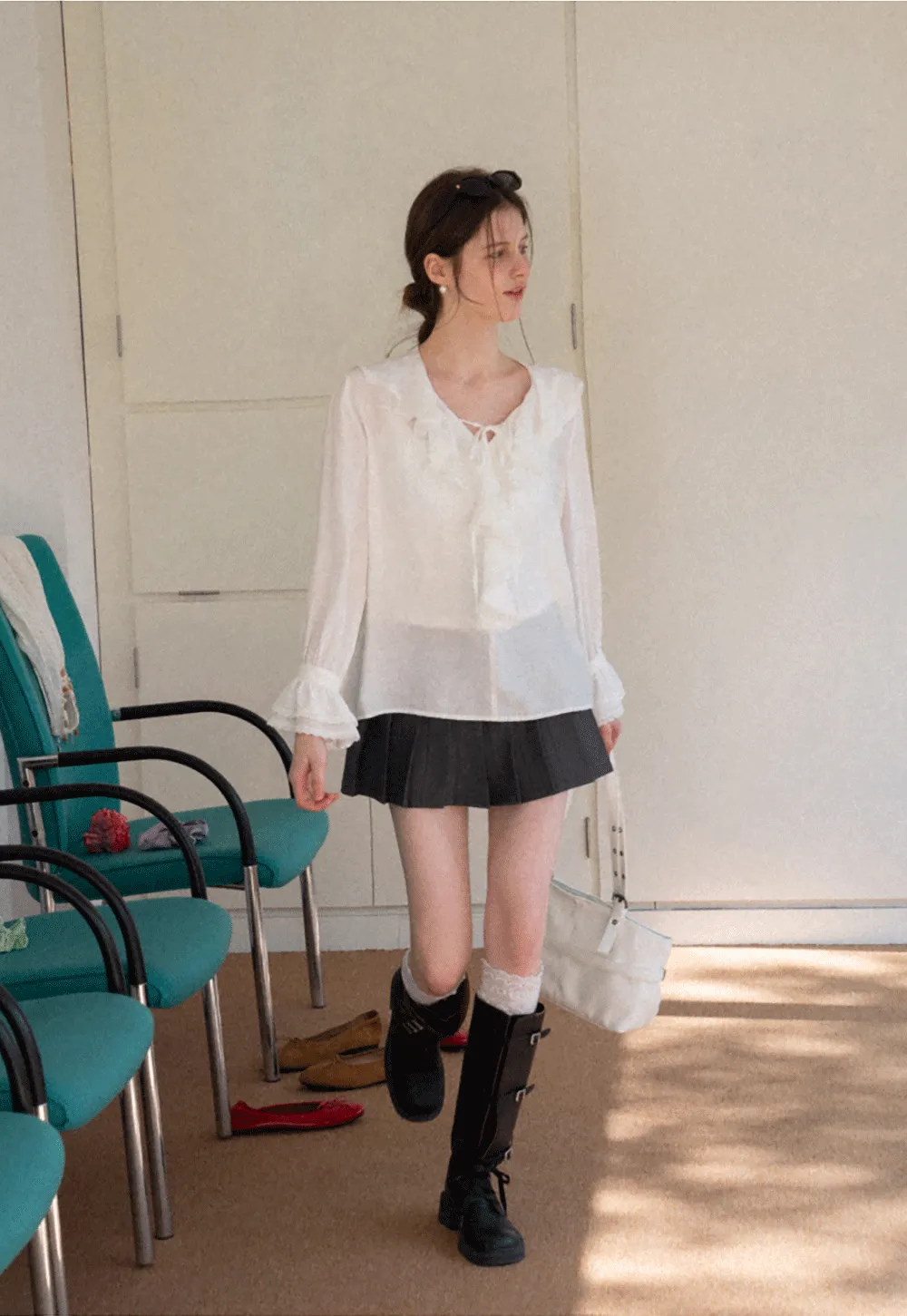 Elegant Blouse with Ruffled Neckline and Flared Sleeves