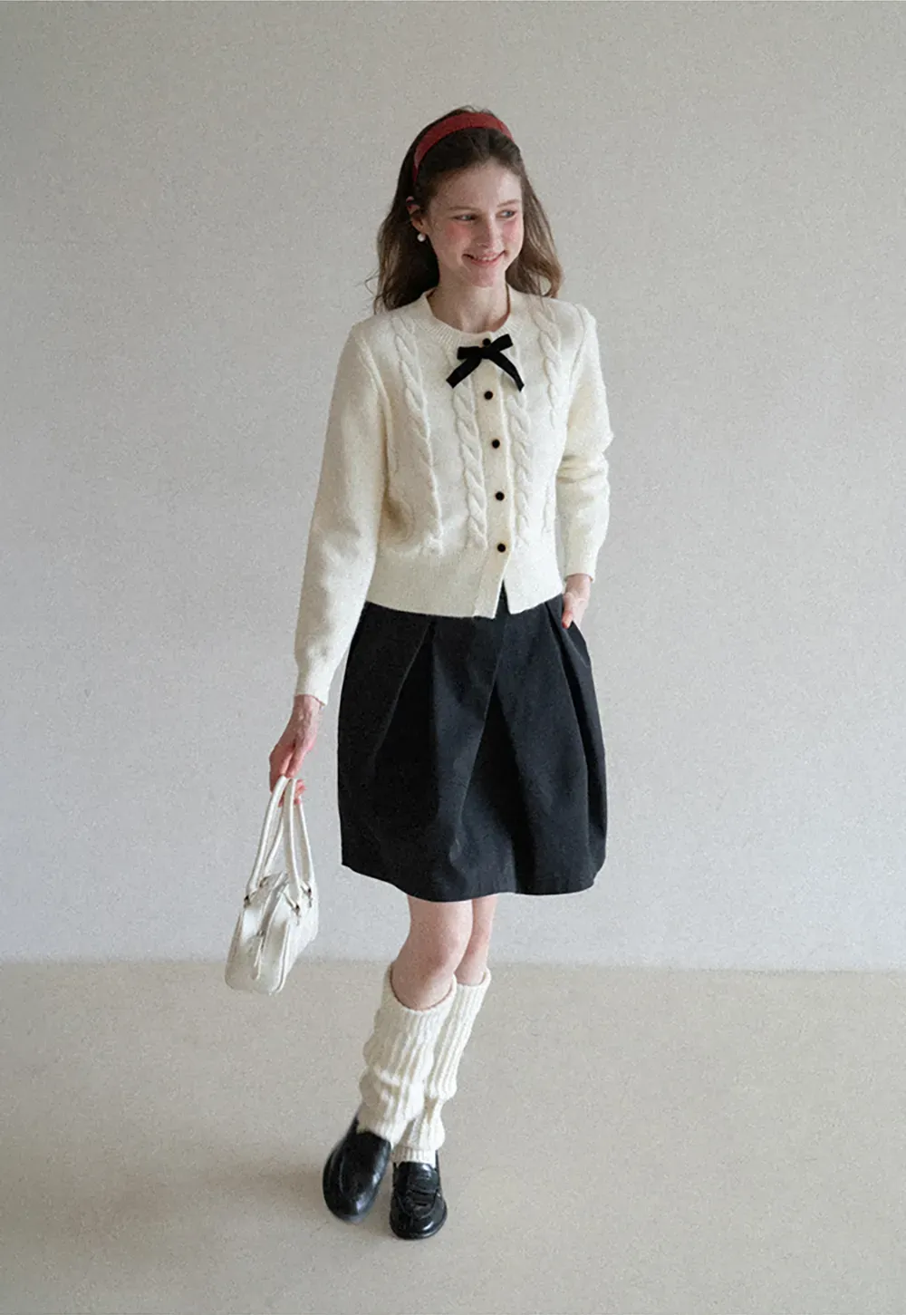 Elegant Cable Knit Cardigan with Bow Detail