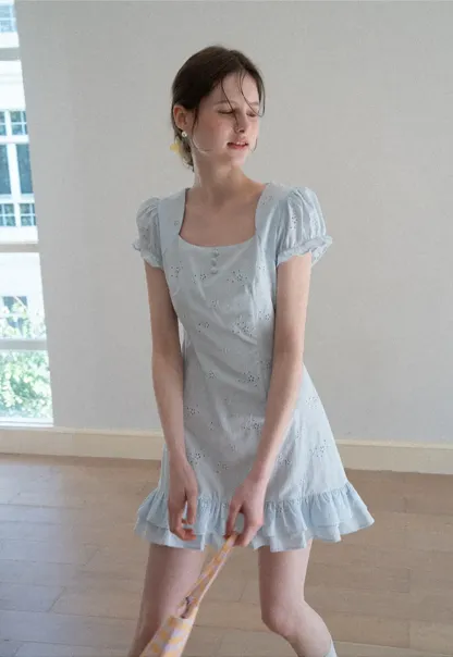 Eyelet dress with puff sleeves and ruffled hem