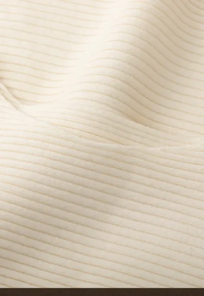 Ribbed knit sweater with tie back and flared hem design