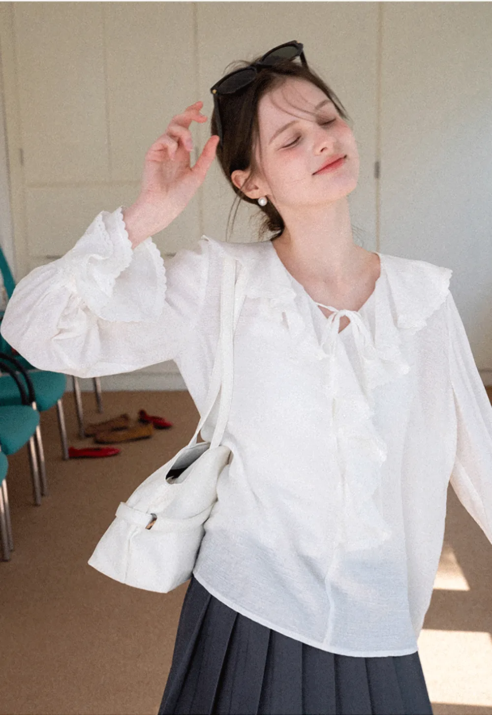 Elegant Blouse with Ruffled Neckline and Flared Sleeves