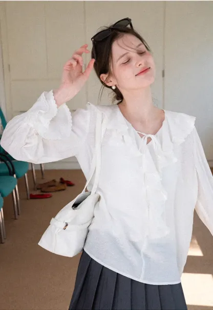 Elegant Blouse with Ruffled Neckline and Flared Sleeves