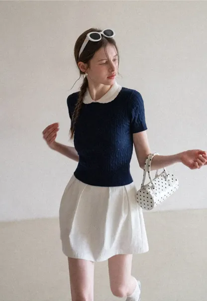 Plaid skirt with pleats and ruffled top