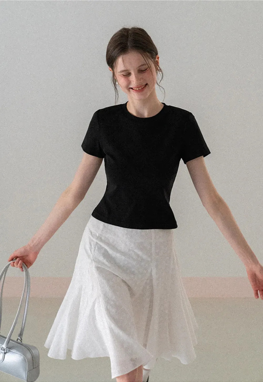 Flared pleated skirt with subtle texture