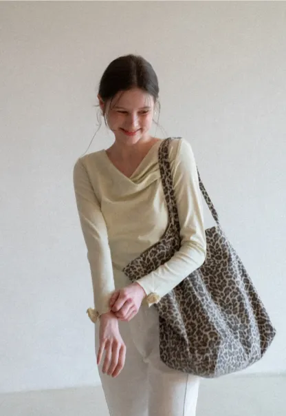 Long sleeve top with ruffled hem and cuffs