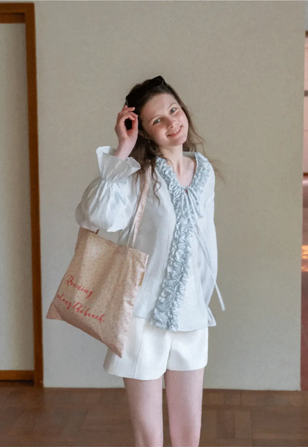 Long sleeve shirt with ruffled neckline and gathered cuffs