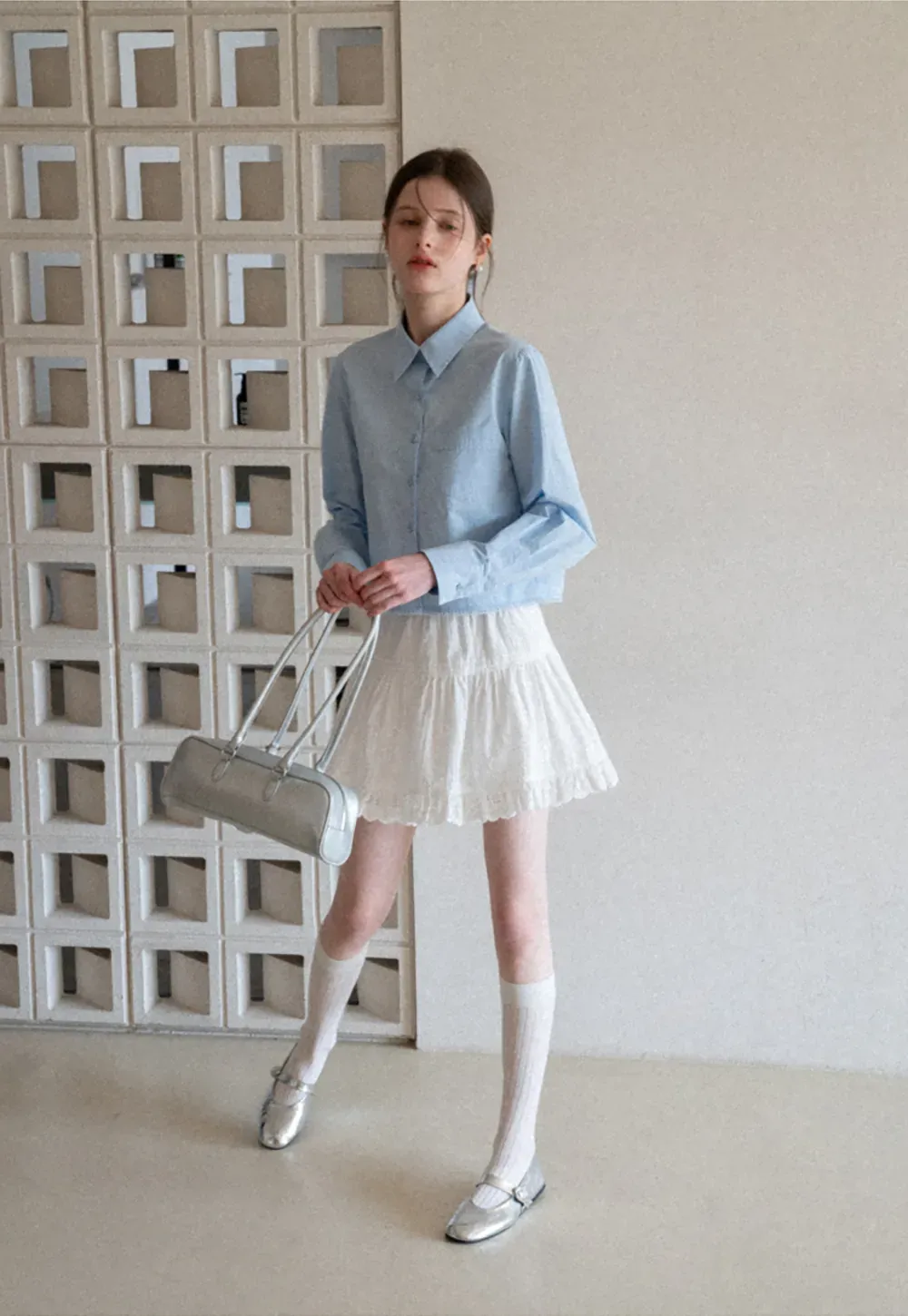 Long sleeve button front shirt with scalloped hem