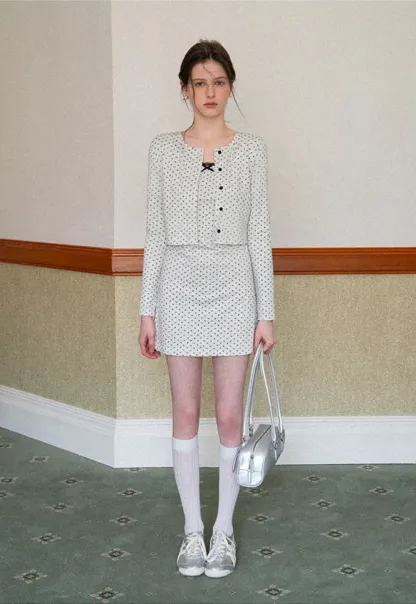 Polka dot dress with lace trim and matching cardigan