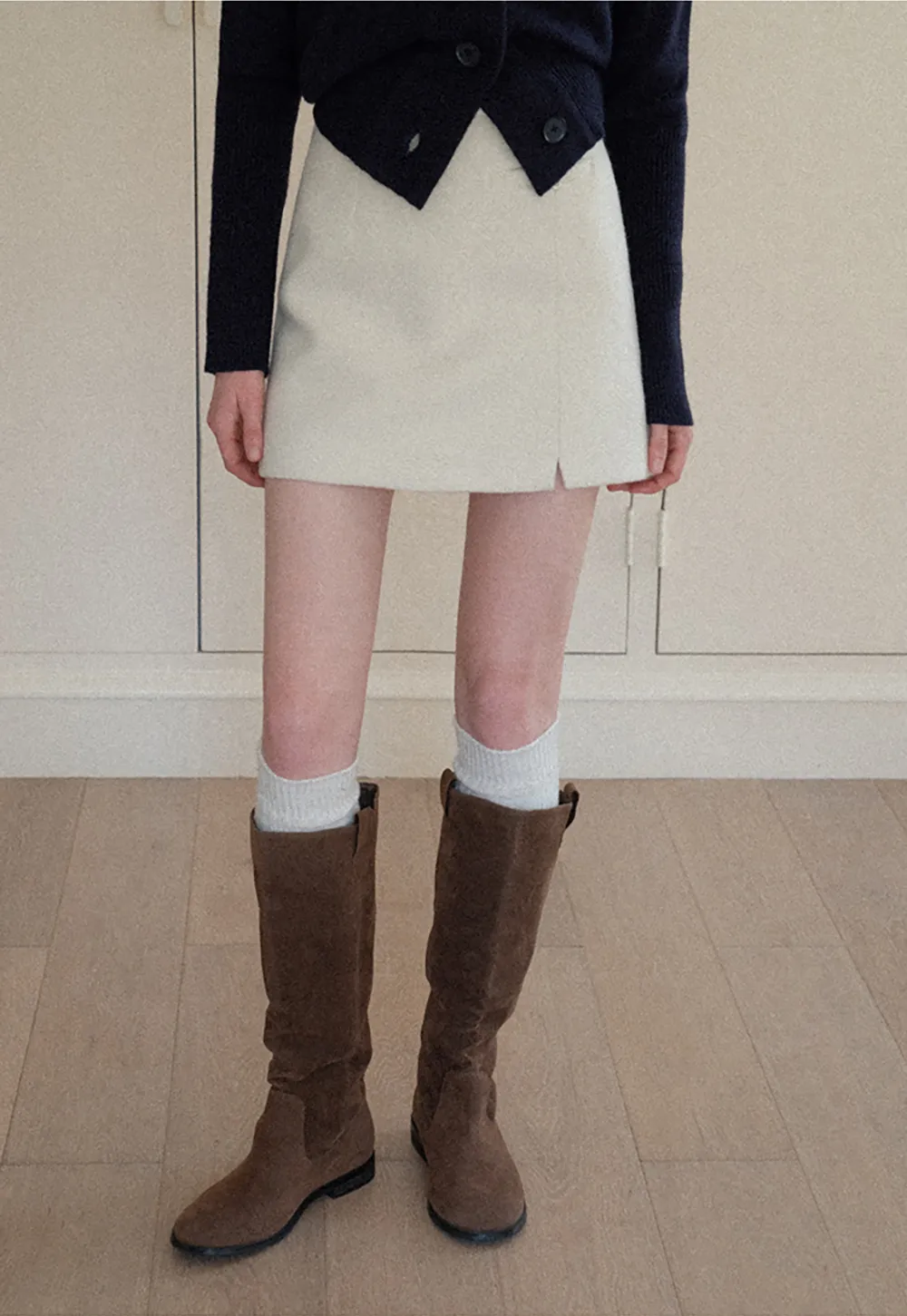 A-line mini skirt with textured fabric and central seam design