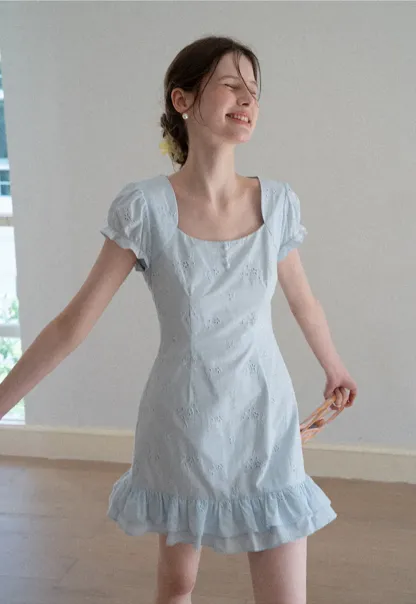 Eyelet dress with puff sleeves and ruffled hem