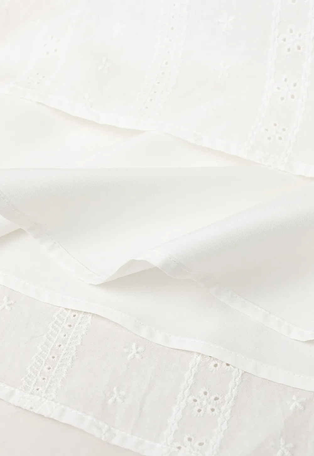 Halter neck sleeveless top with buttons and pleated skirt