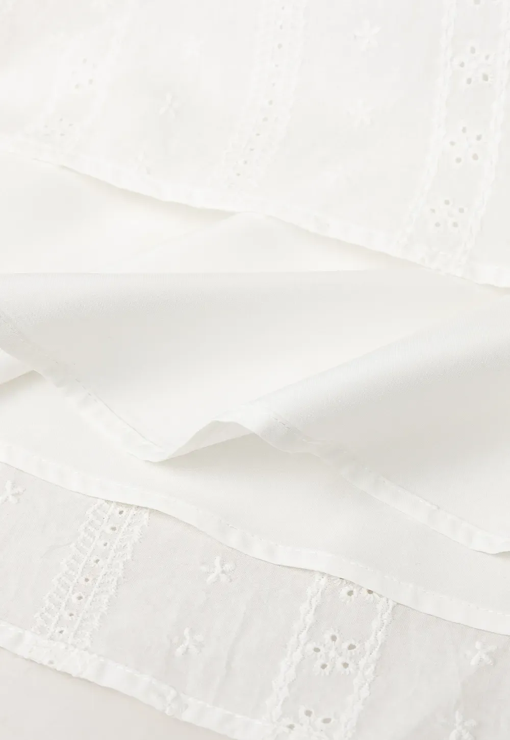 Halter neck sleeveless top with buttons and pleated skirt