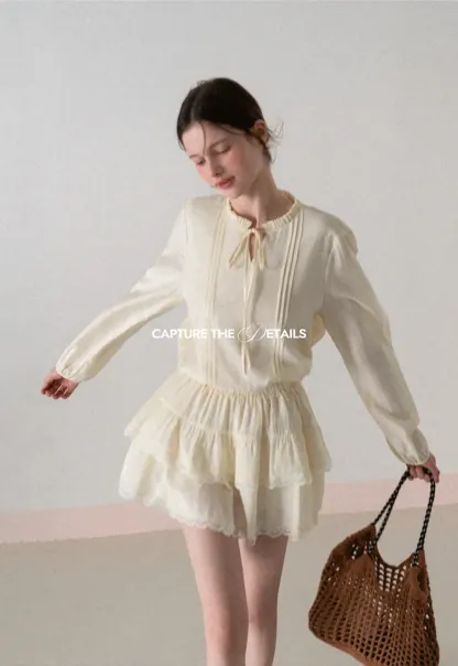 Shirt with ruffled collar and tie front layered skirt