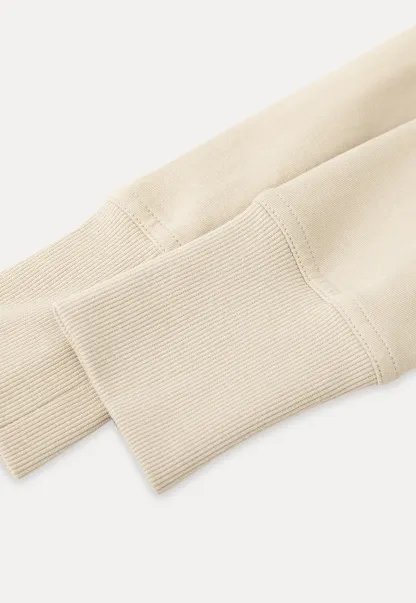 Short jacket with button front and ribbed cuffs