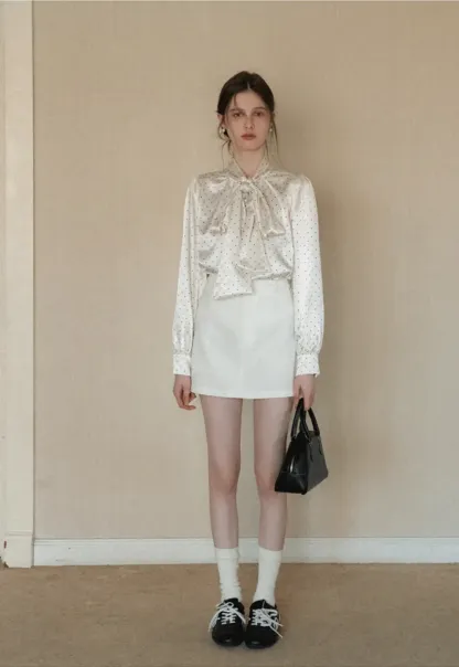 Elegant blouse with bow collar and long sleeves