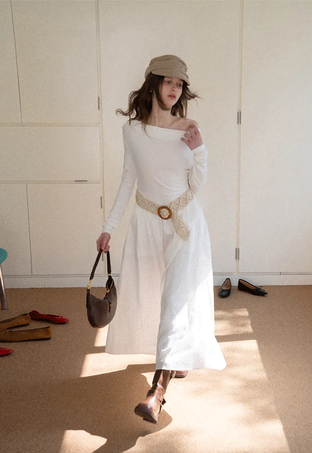 Elegant asymmetrical long sleeve dress with unique belt design