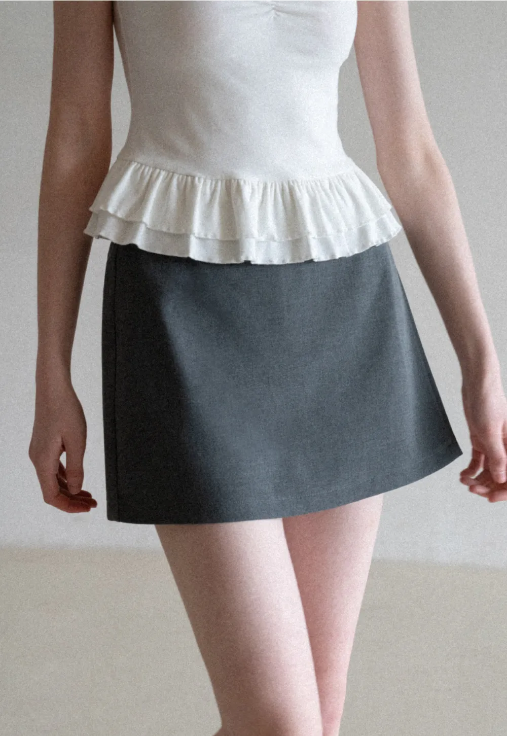 Elegant Pleated Mini Skirt with Asymmetrical Hem
