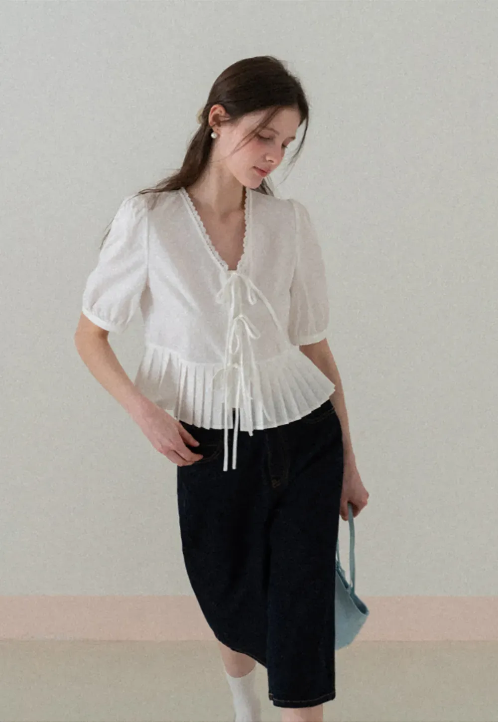 V neck short sleeve blouse with pleated hem and tie front