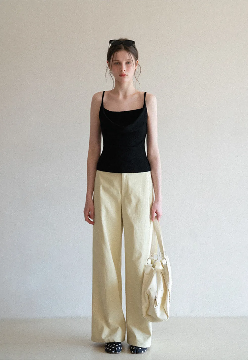 Silk-like tank top with thin straps and draped neckline