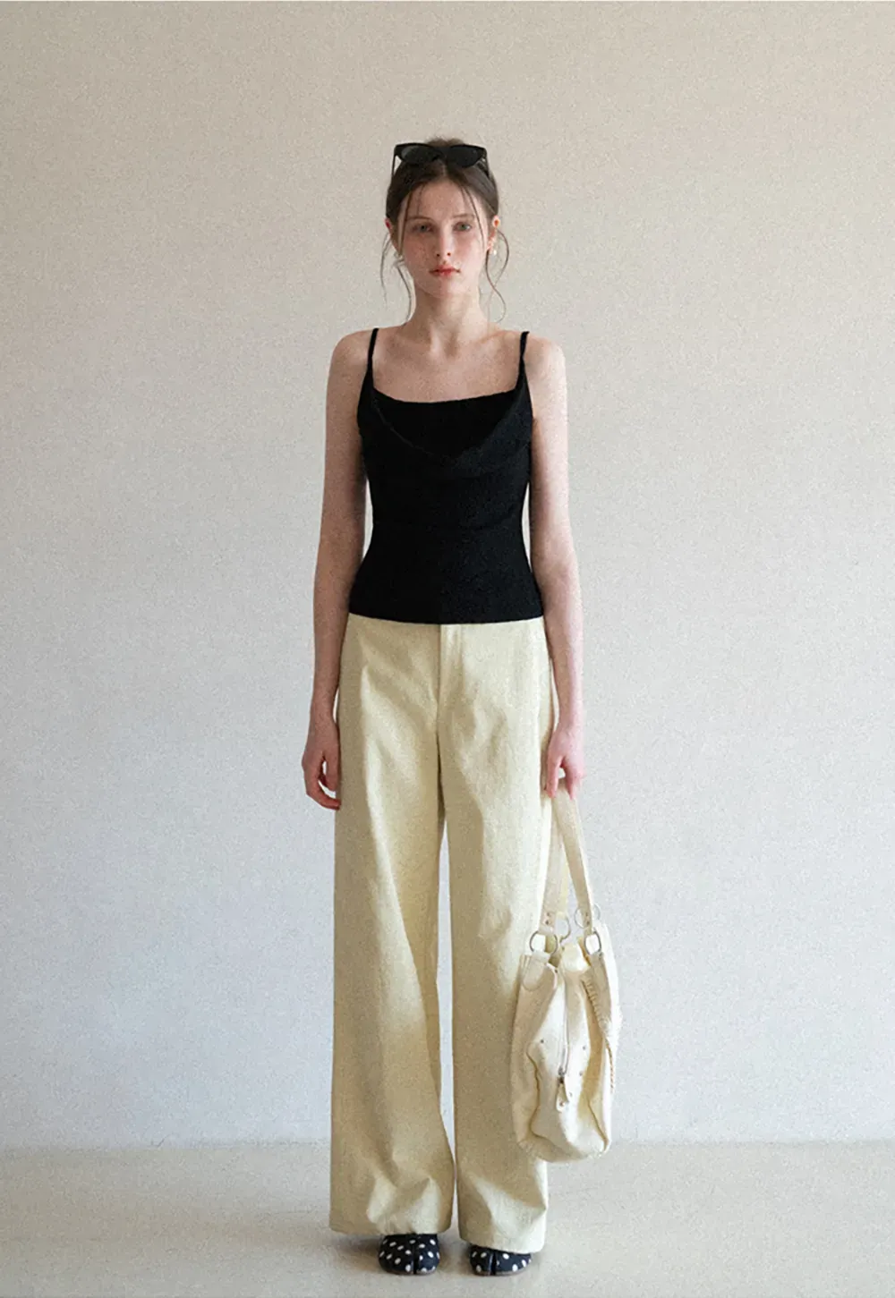 Silk-like tank top with thin straps and draped neckline