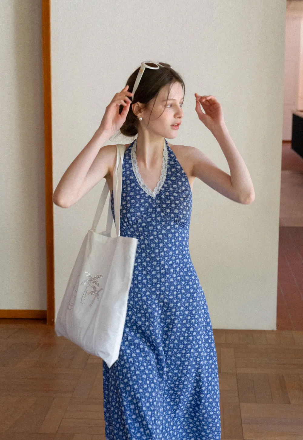 Halter neck dress with floral print and lace trim