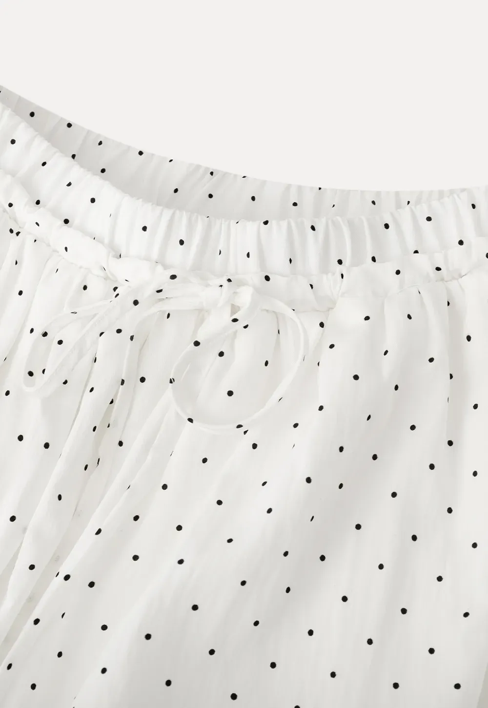 Polka dot pleated mini skirt with drawstring waist
