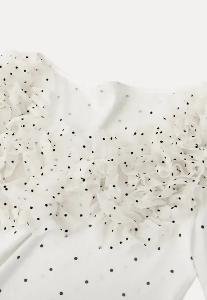 Polka dot long sleeve top with ruffled neckline