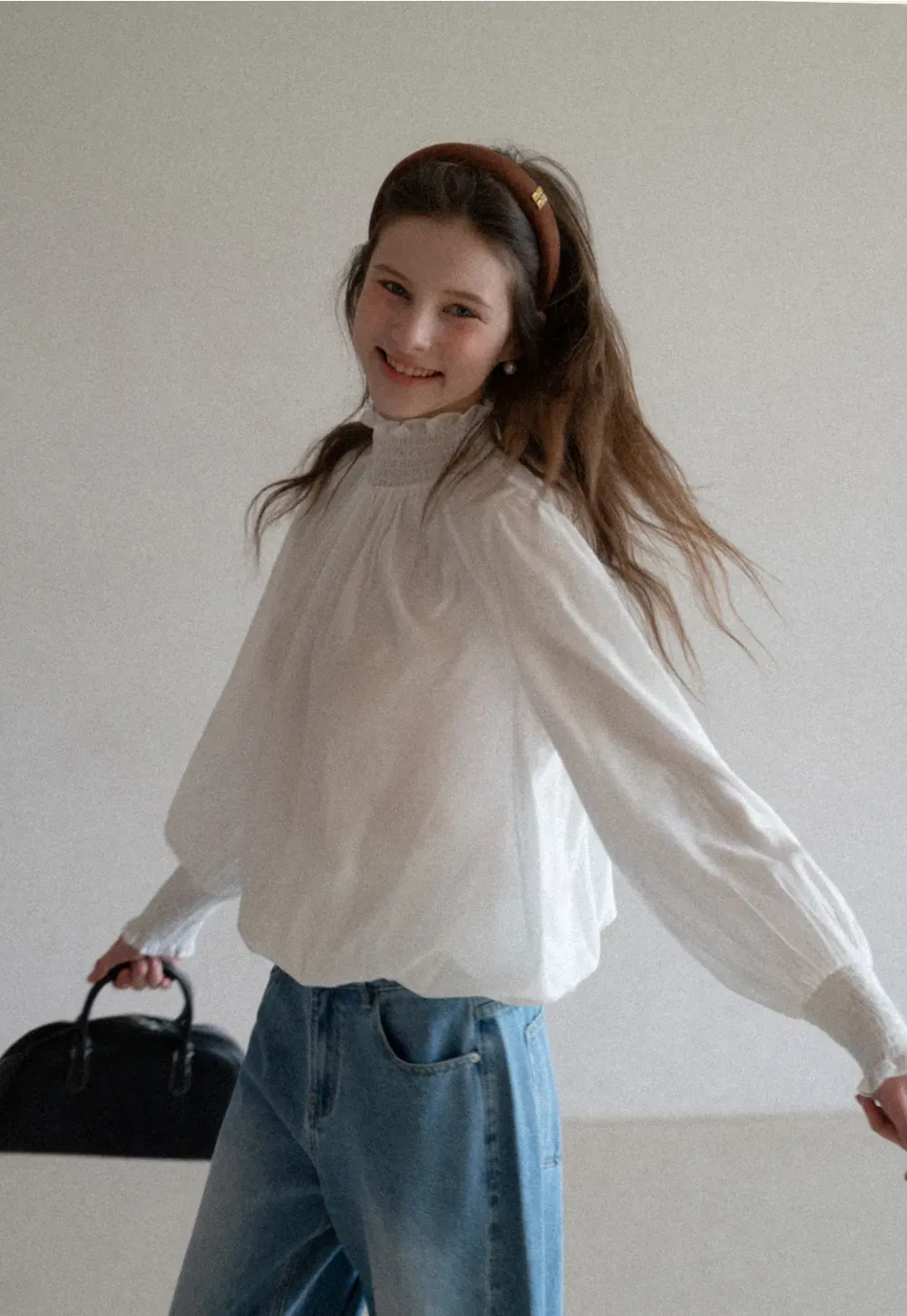 Elegant High Neck Blouse with Ruffled Cuffs and Hem