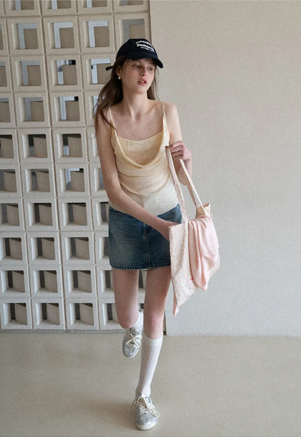 Silk-like tank top with thin straps and draped neckline