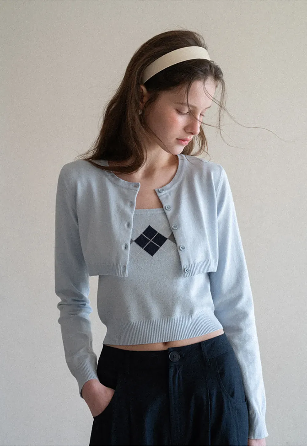 Woolen knit sweater with argyle pattern and buttons