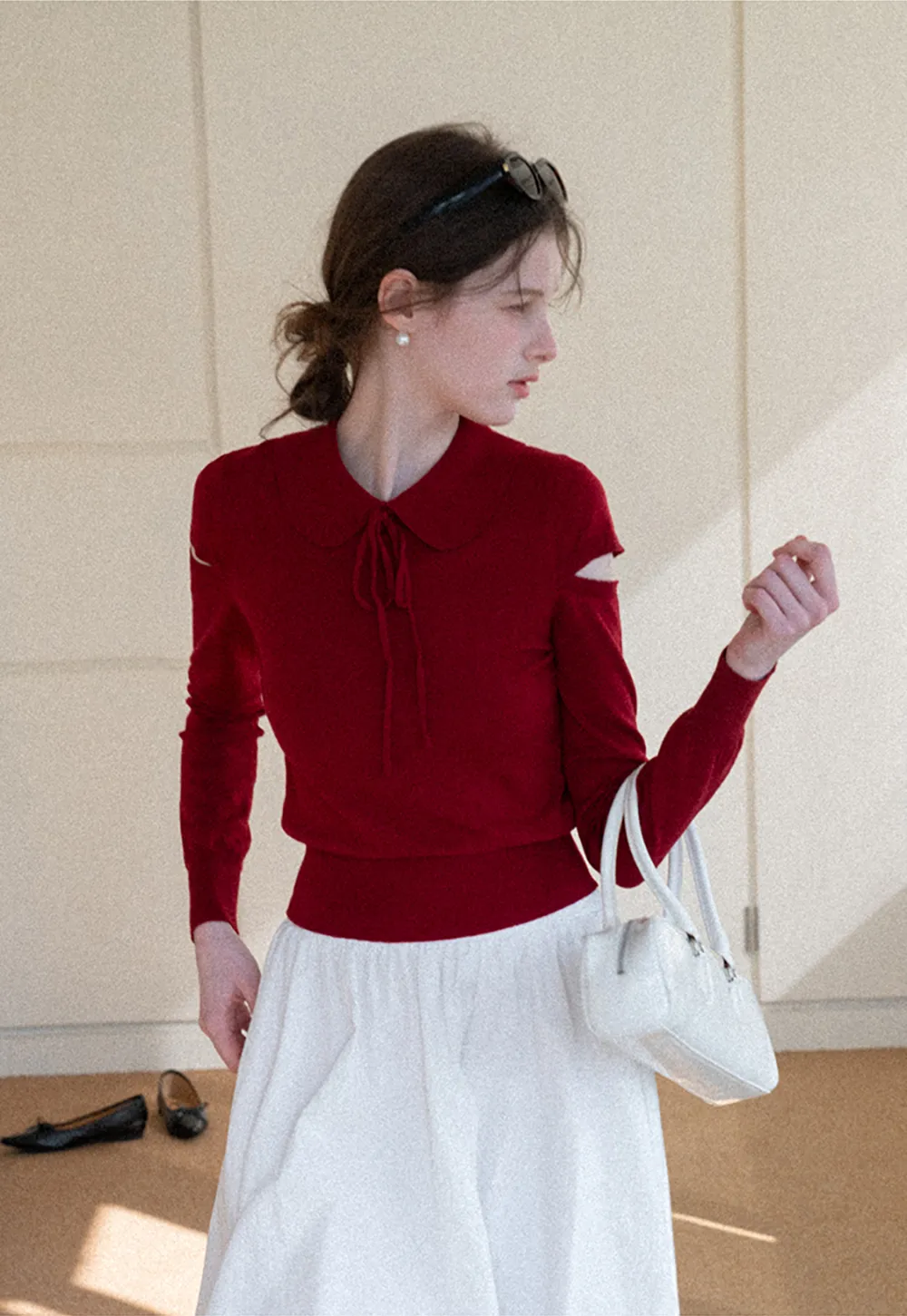 Elegant Knit Sweater with Bow Detail and Cutout Sleeves