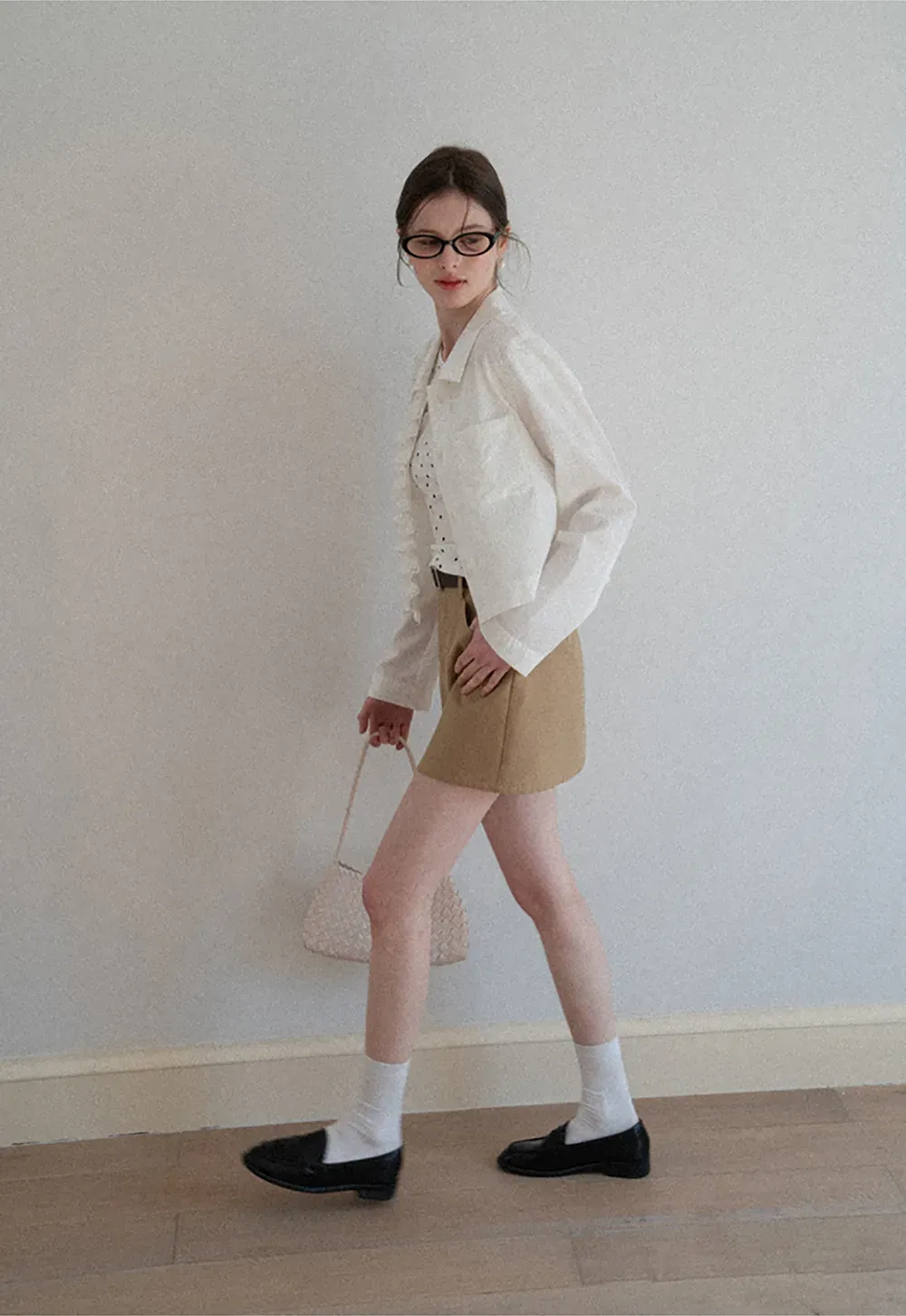 Short jacket with ruffled front placket and collar