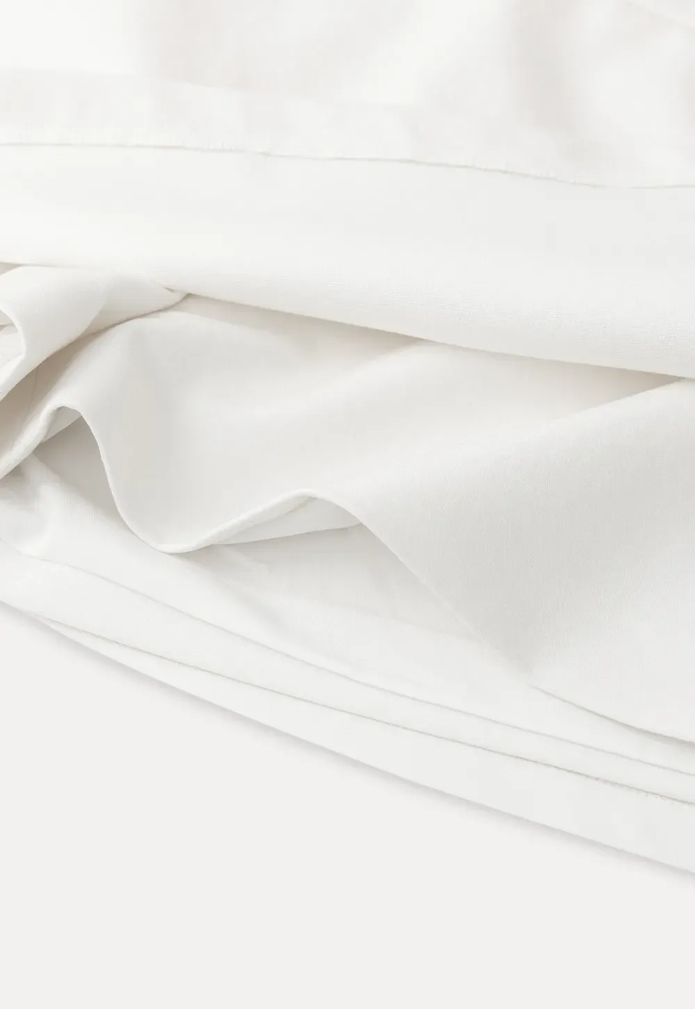 Elegant Pleated Mini Skirt with Asymmetrical Hem