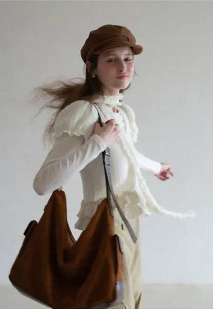 floral lace top with puffed sleeves and ruffled hem