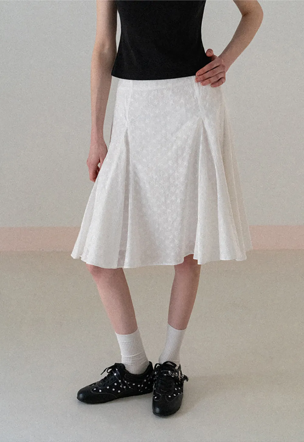 Flared pleated skirt with subtle texture