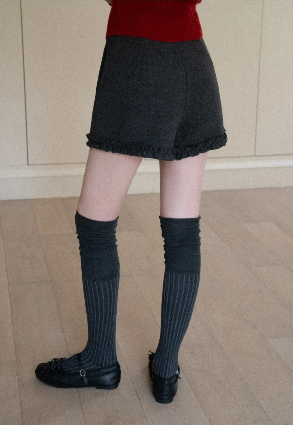 High waist shorts with ruffle hem and belt design