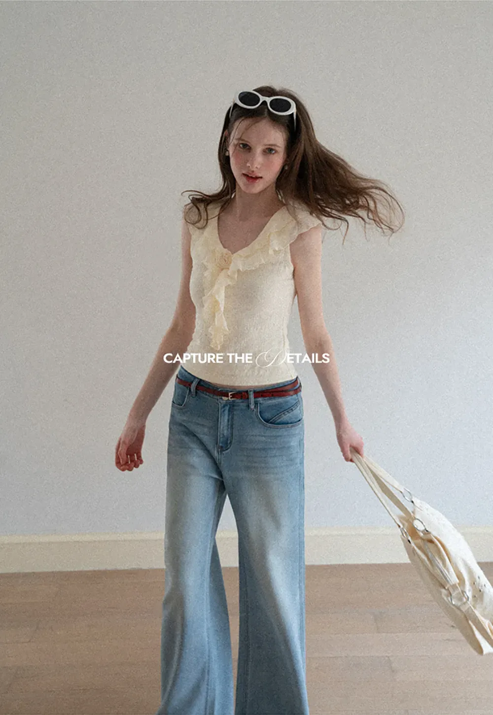 Sleeveless Top with Ruffled V Neck and Floral Detail