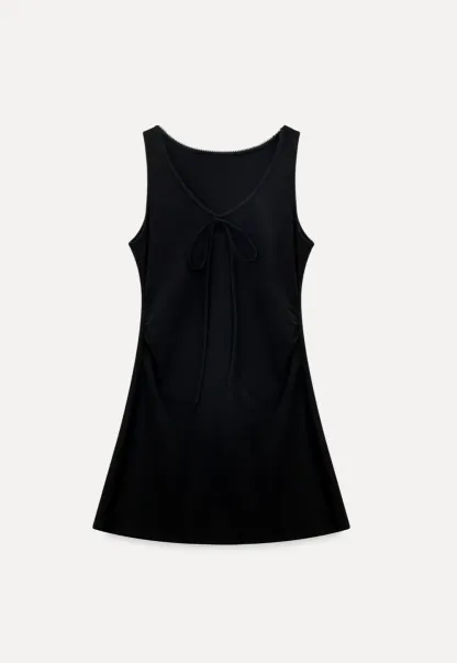 Sleeveless dress with front tie detail and t shirt