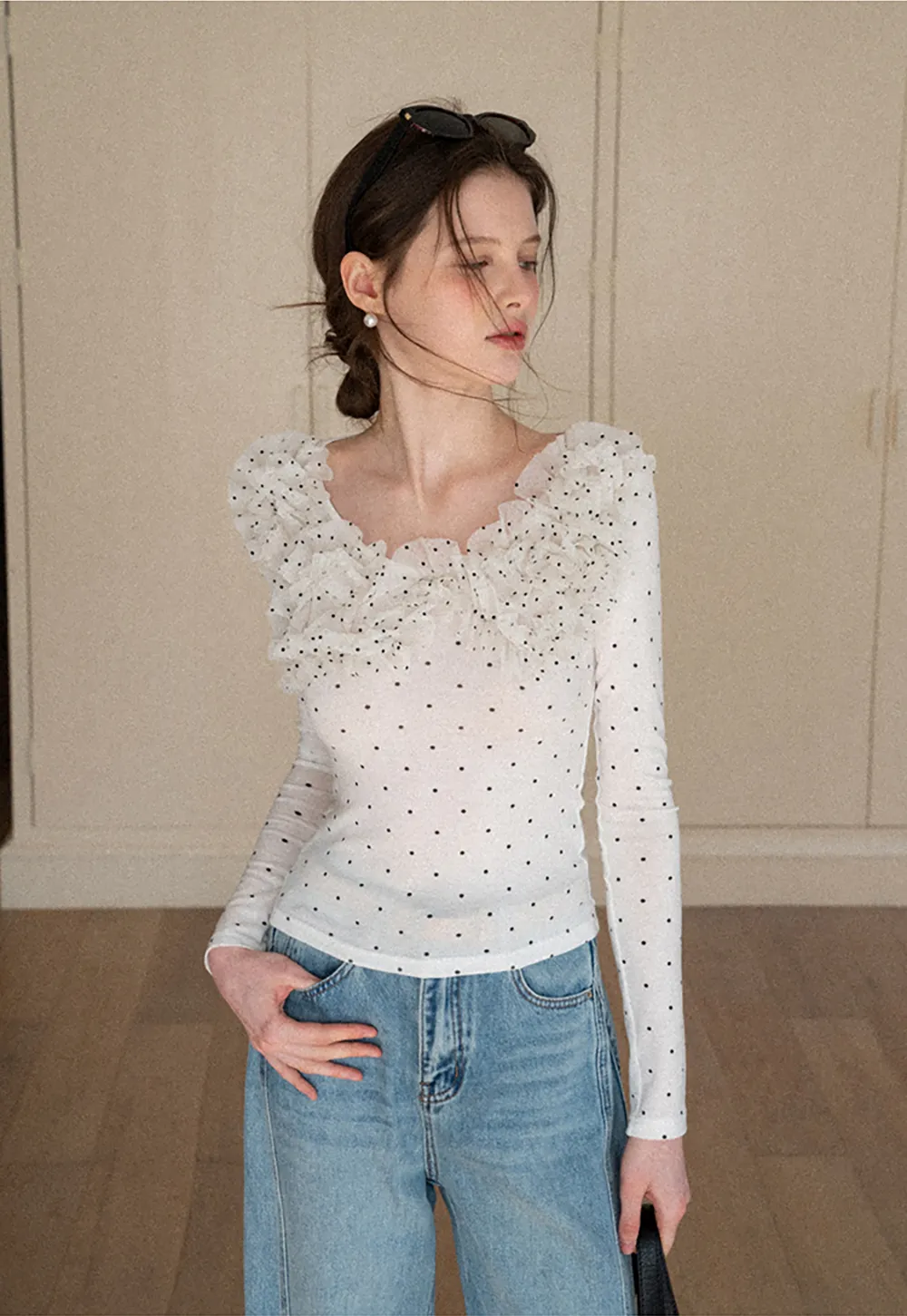 Polka dot long sleeve top with ruffled neckline