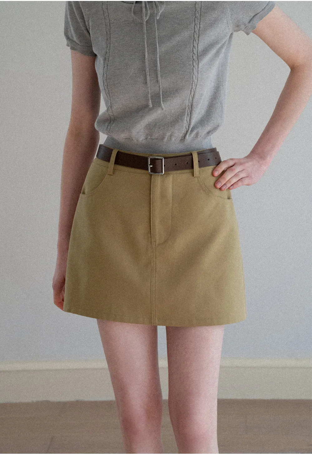 A-line mini skirt with front pockets and belt loops