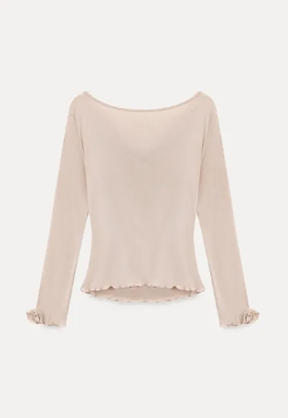 Long sleeve top with ruffled hem and cuffs