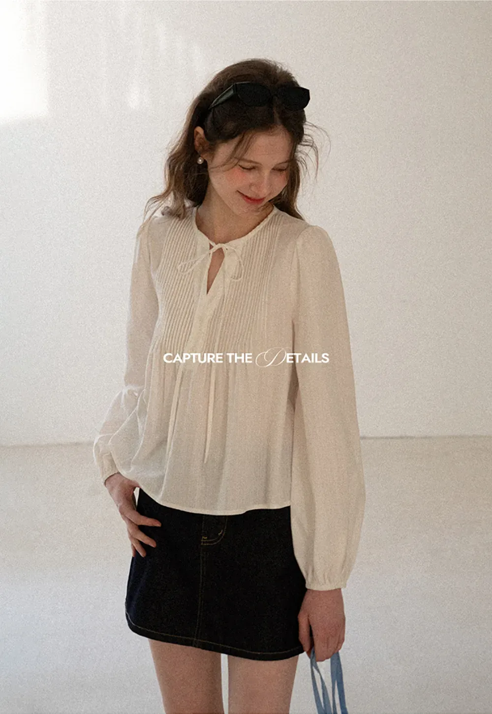 A-line denim skirt with front pocket design and adjustable waistband.