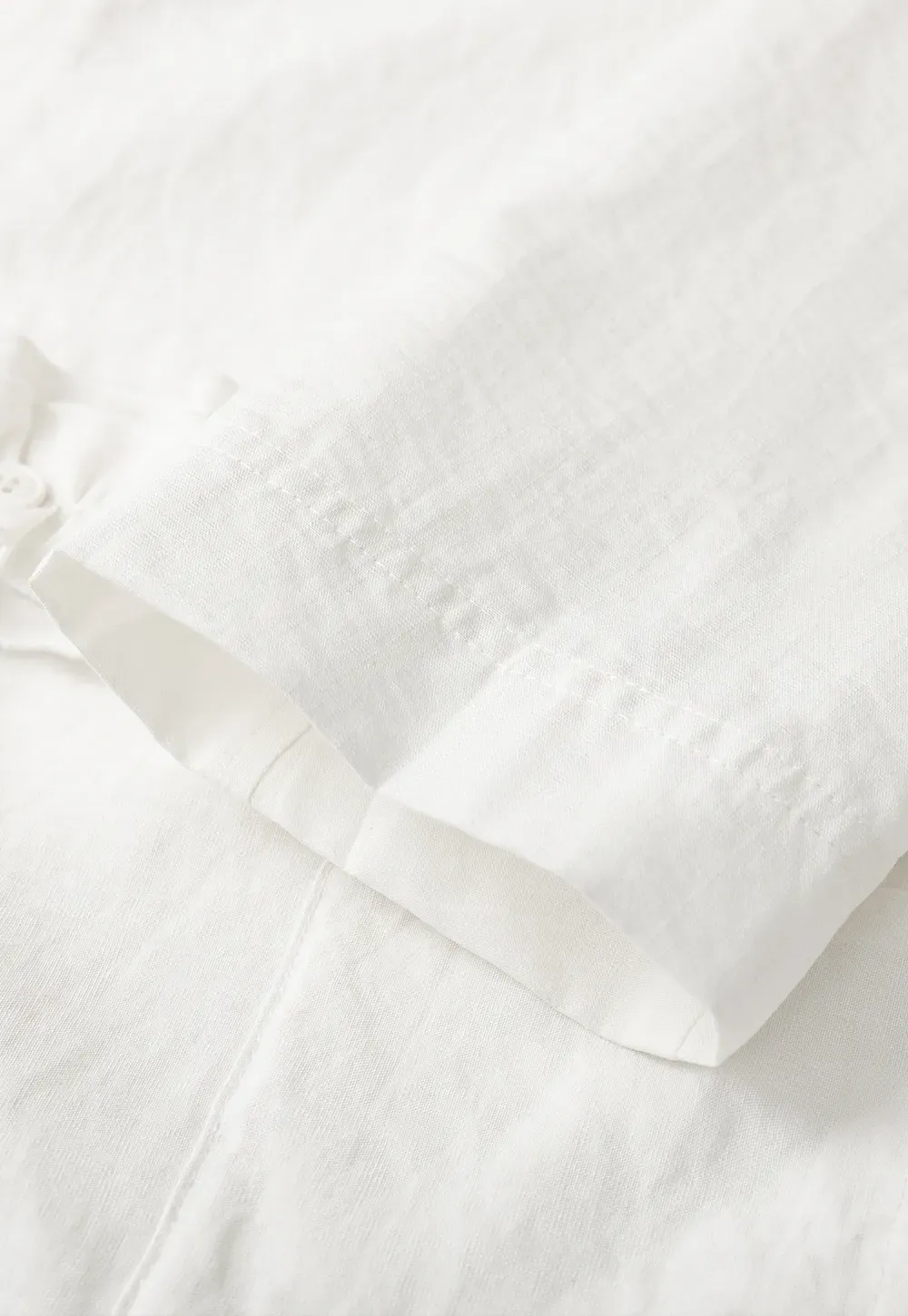 Short jacket with ruffled front placket and collar