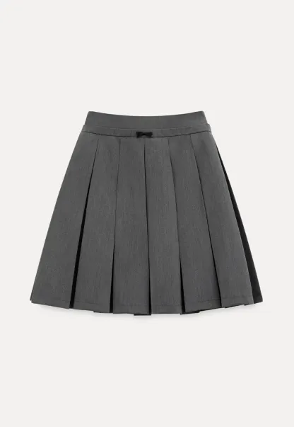 Pleated skirt with front bow detail