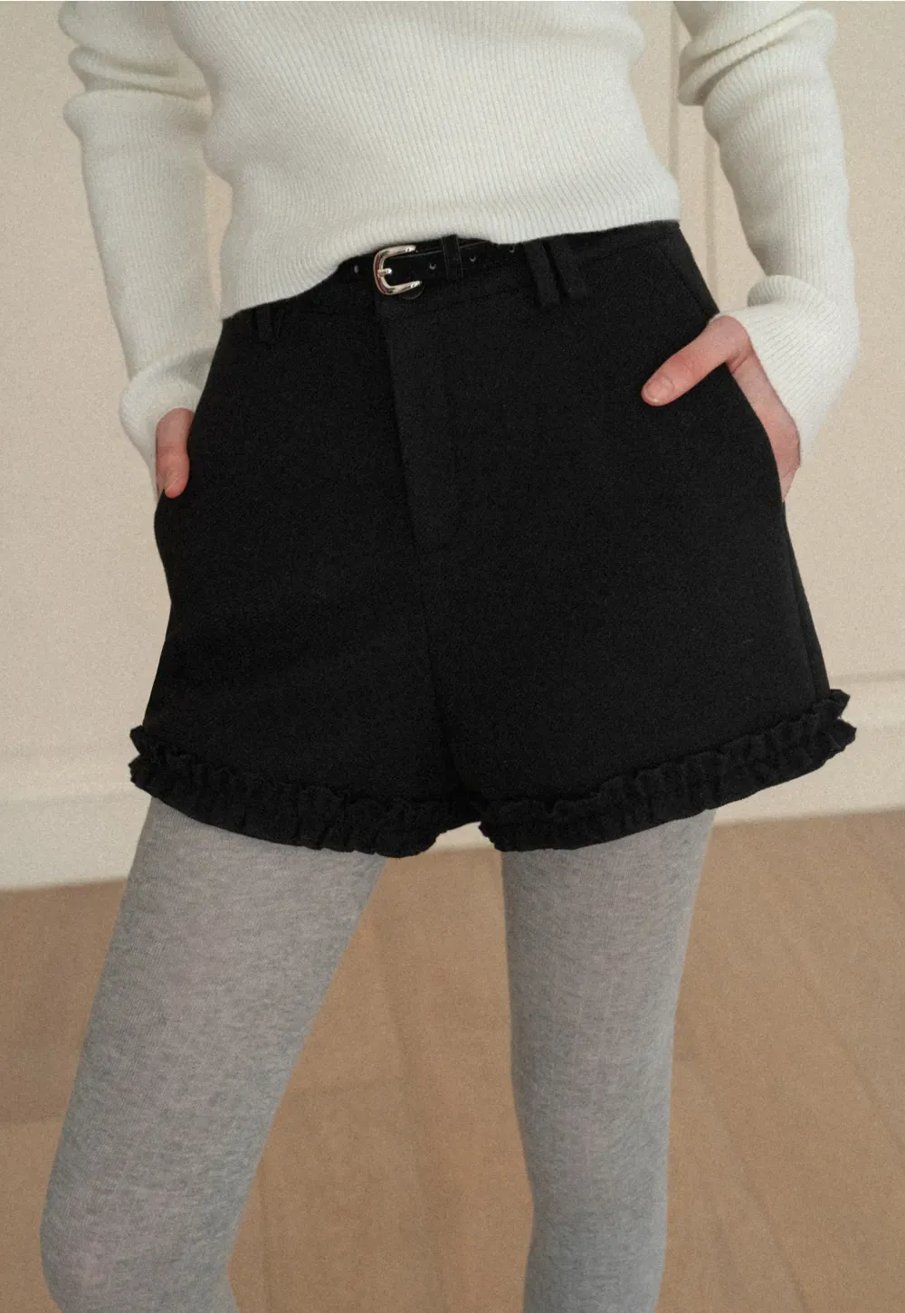 High waist shorts with ruffle hem and belt design