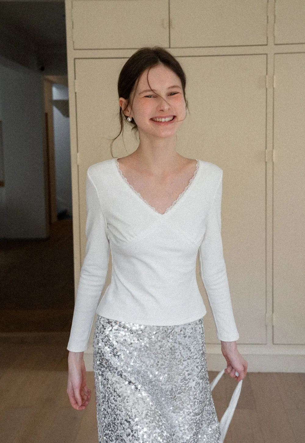 V neck long sleeve top with lace trim and fitted design