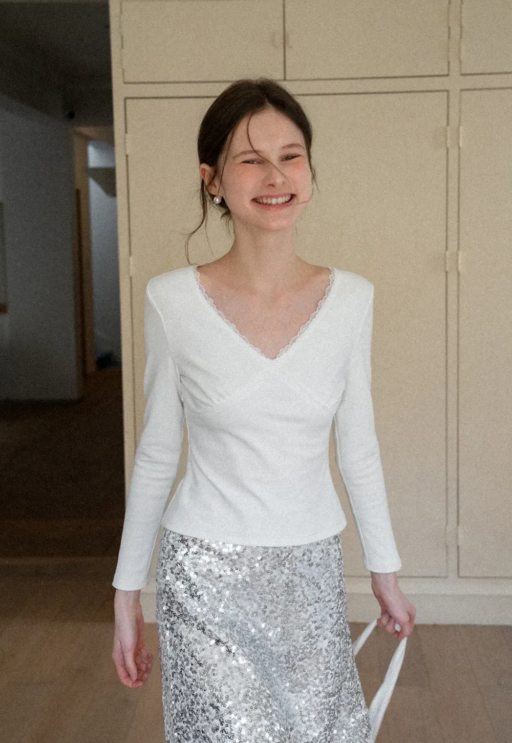 V neck long sleeve top with lace trim and fitted design