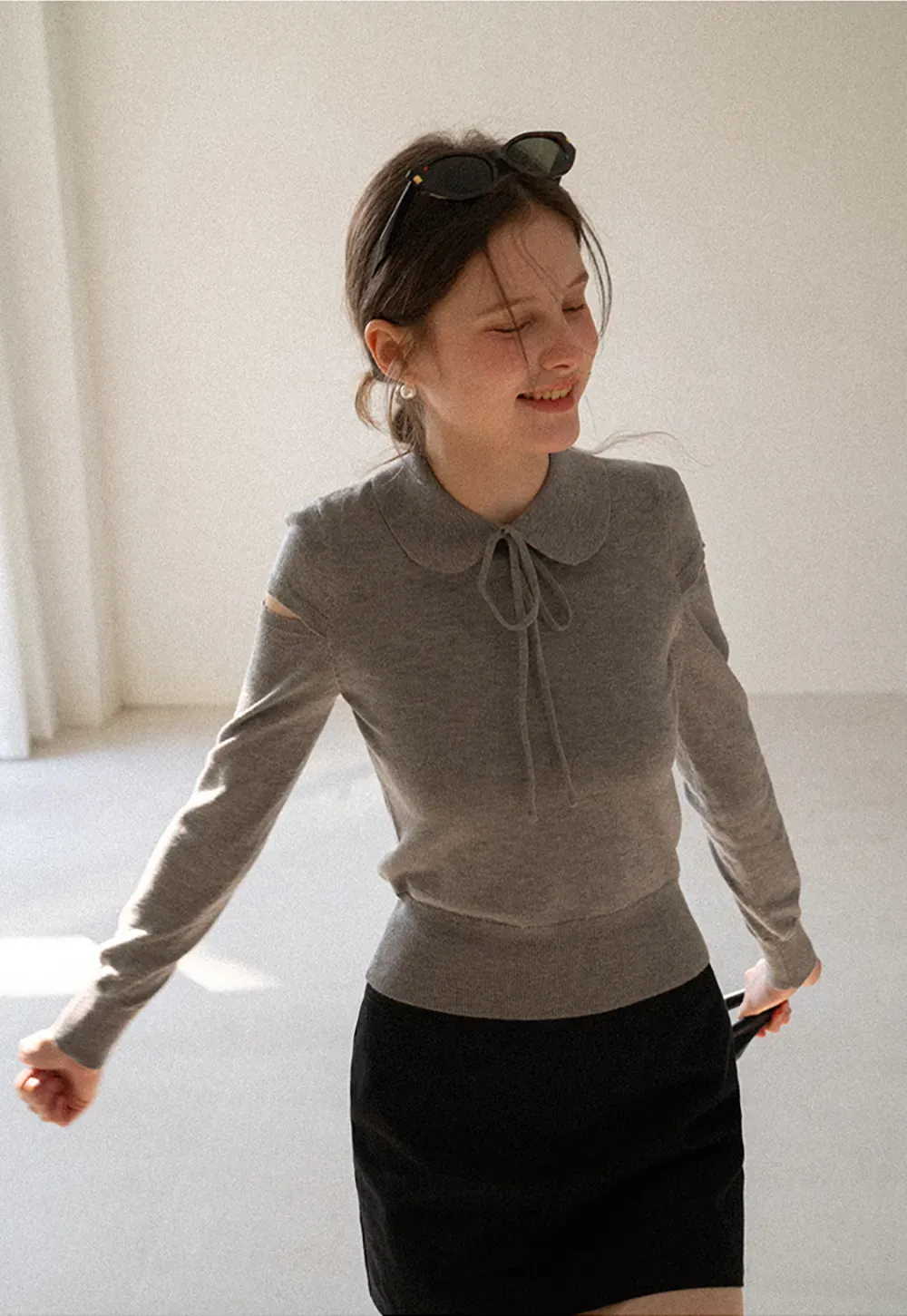 Elegant Knit Sweater with Bow Detail and Cutout Sleeves