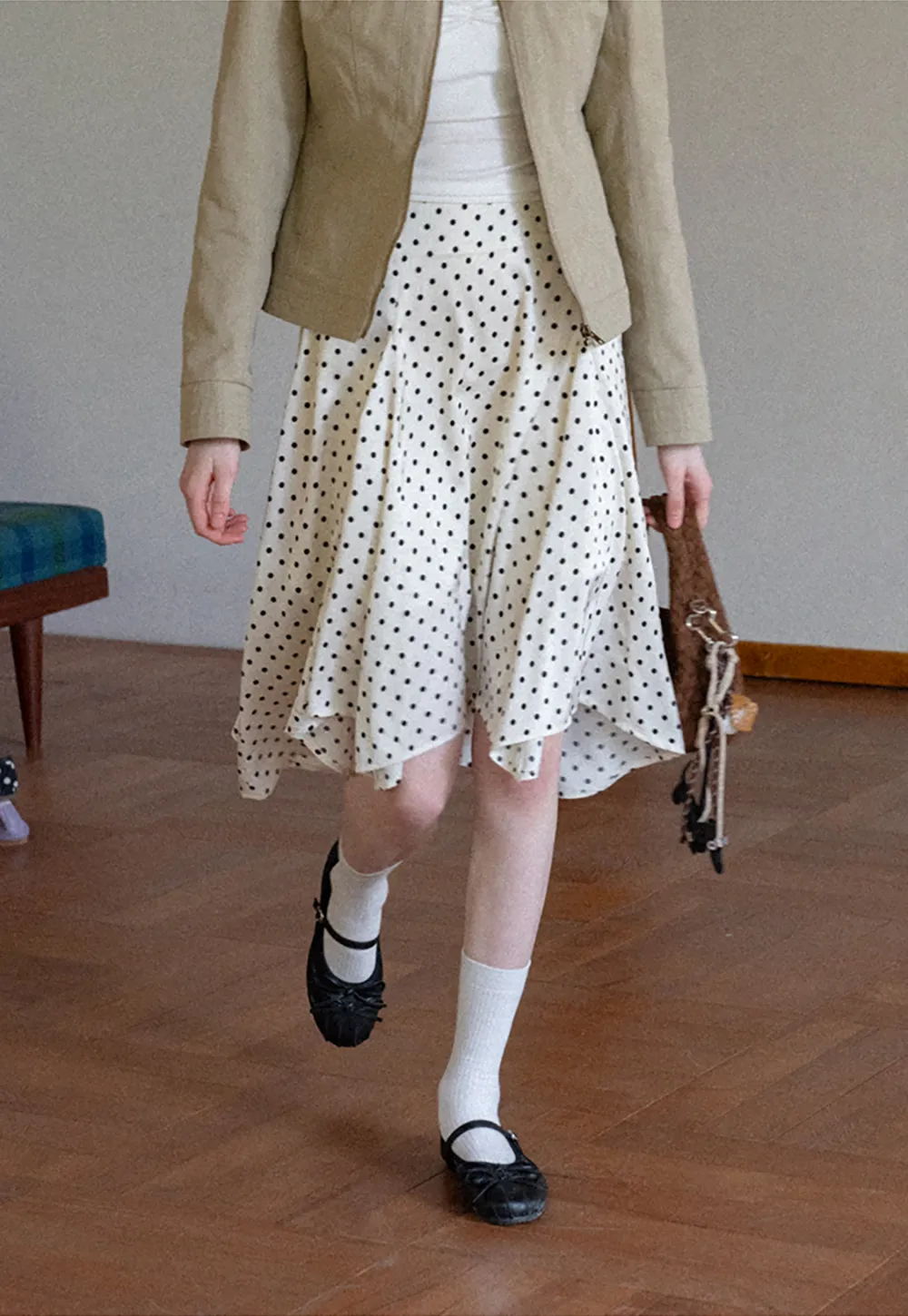 Polka dot asymmetrical hem skirt with pleats